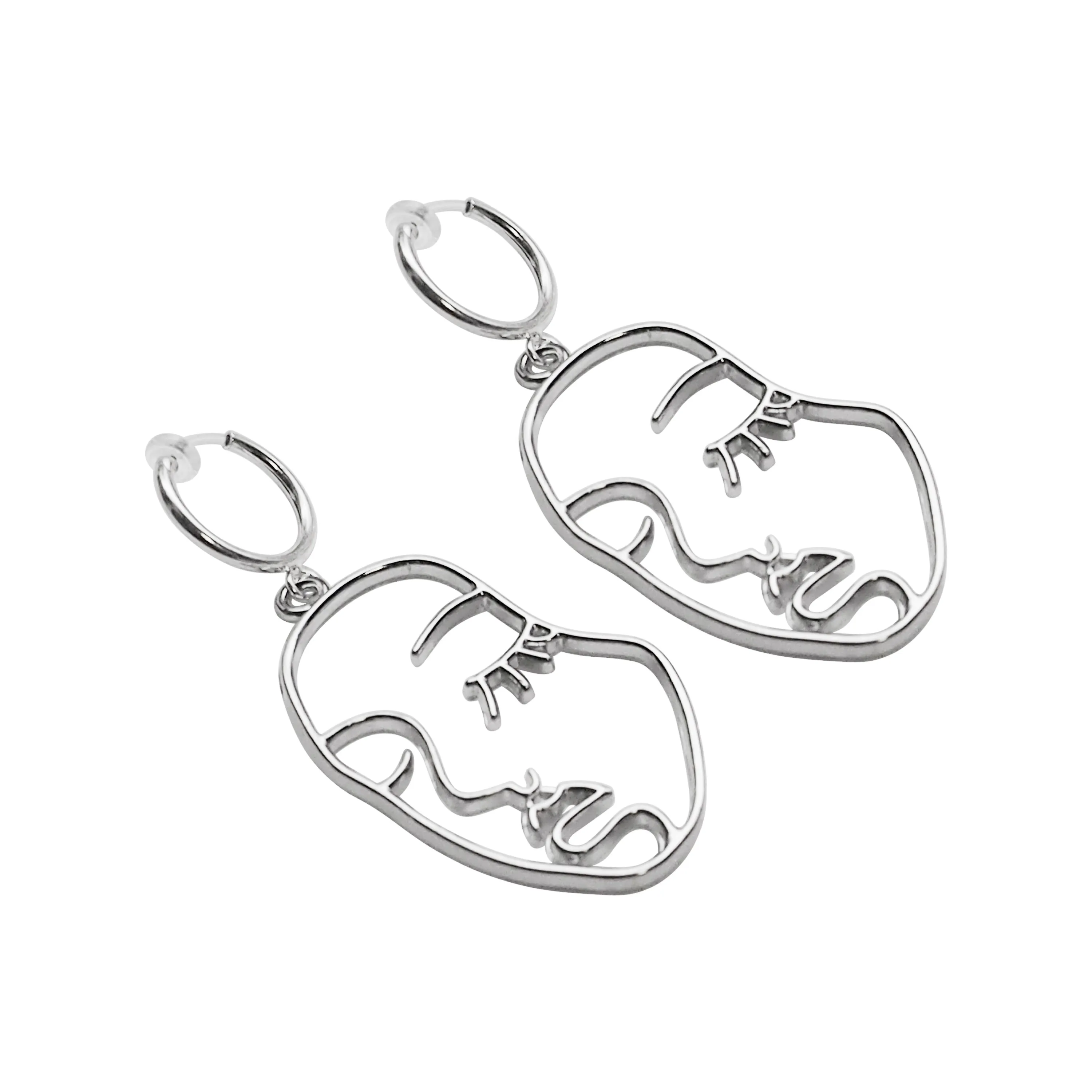 Silver human face clip on hoop earrings